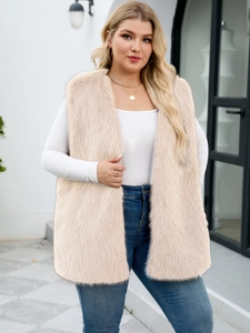 Detail of light beige faux fur vest showing soft texture and sleeveless V-neck design