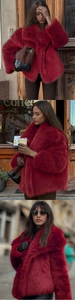 Detail of the wine red faux fur coat showing fluffy texture and large lapel collar