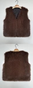 Detailed view of dark brown faux fur vest with V-neck design and smooth black lining