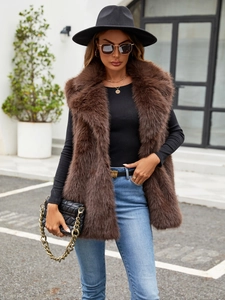 Detailed close-up of brown faux fox fur vest showing the plush collar and soft texture