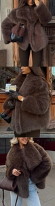 Close-up of thick coffee brown faux fur coat with oversized collar for winter style