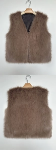 Detail view of brown faux fur vest with black satin lining and premium long plush texture