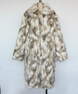 Macro view of plush brown faux fox fur texture and lapel collar on men's winter coat