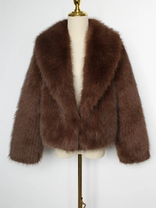 Detailed view of thick dark brown faux fur texture and wide lapels on the coat