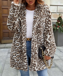 Detail of faux fur coat with leopard print showing plush texture and lapel design