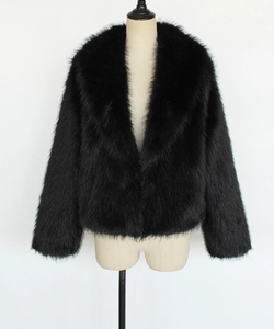 Detail view of a black faux fur coat featuring a plush wide collar and elegant texture