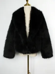Detail of black faux fur jacket showing plush texture and classic wide notched lapels