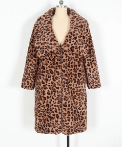 Detail shot of the plush leopard print faux fur texture and wide lapel of the coat