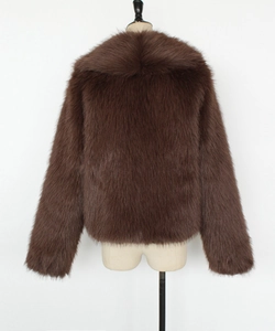 Detail of high-density brown faux fur coat showing thick lapel texture on mannequin