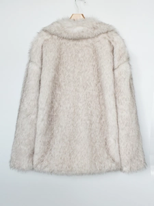 Detail of light grey faux fur coat showing thick plush texture and luxury long sleeves