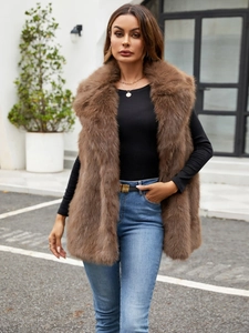 Detailed close-up showing the dense and fluffy texture of the dark brown faux fox fur vest