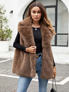 Detail of premium brown faux fox fur vest with thick texture and stylish wide collar