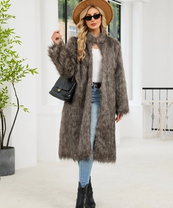 Detail shot of mid-length dark grey faux fox fur coat styled with jeans and boots