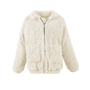 Close-up of beige sherpa fleece jacket texture with zipper closure and side pockets