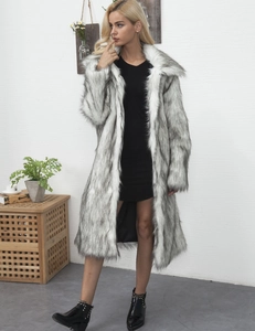Detail shot of long faux fur coat with black and white texture and wide lapels