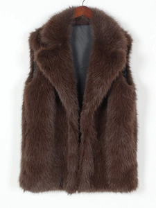 Detail of dark brown faux fox fur vest with plush texture and smooth silk lining