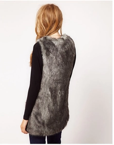 Rear view of a long faux fur vest with black and grey gradient texture and plush finish