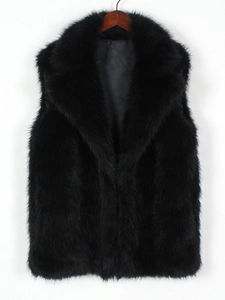 Close-up detail of black faux fox fur vest showing the plush texture and large collar