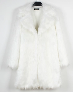 Detail of white faux fur coat featuring a large lapel and soft plush texture