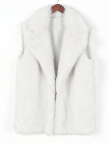 Close-up of fluffy white faux fox fur vest showing the plush texture and smooth inner lining