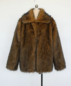 Detail of brown faux fur jacket showing high-quality plush texture and large lapel collar