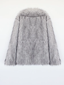 Detail of silver gray faux fox fur texture on a thick winter jacket with long fibers