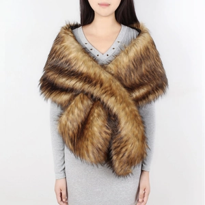 Detail of elegant tan faux fur shawl wrap with dark hair tips showing plush texture