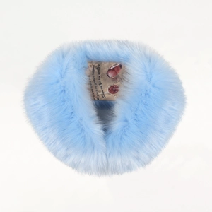 Detail view of a fluffy light blue faux fur scarf wrap with dense soft plush texture