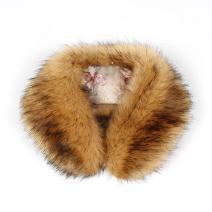 Close-up of dense brown faux fox fur collar with brand logo printed on the inner lining