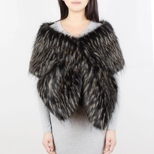 Detailed view of thick black and brown faux fur stole styled with a long sleeve grey dress