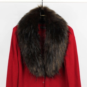 Close-up of fluffy dark brown faux fur collar on vibrant red ribbed knit cardigan sweater