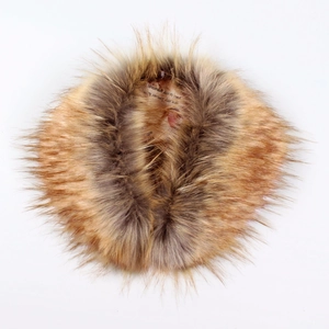 Macro detail of faux fox fur collar showing dense long fibers and gradient brown color