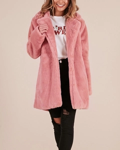 Detail shot of the plush texture and wide collar on this pink faux fur coat for women