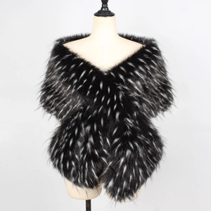 Detail of cross-wrapped faux fox fur shawl with black and white textured plush texture