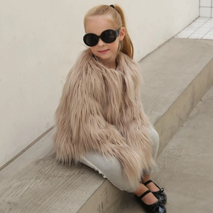 Close-up of the long-pile faux fur texture on this trendy warm beige children's coat