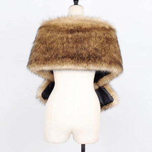 Detailed macro view showing faux fur texture and smooth black lining of the brown shawl