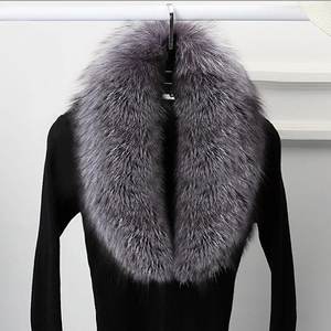 Detailed close-up of luxurious thick faux fur collar in gradient grey for winter warmth