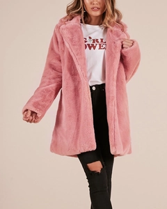 Detail of soft pink faux fur coat featuring a wide collar and luxurious plush texture