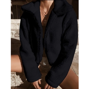 Detail shot of black teddy jacket with thick faux wool texture and cozy plush lapel