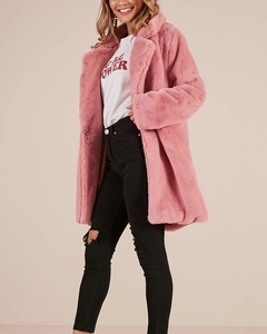 Detail showing high-quality pink faux fur texture and lapel design on mid-length coat
