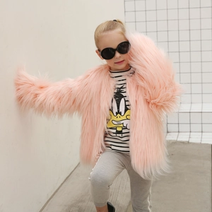 Detailed view of kids' fluffy faux fur coat in pale pink with soft long pile texture