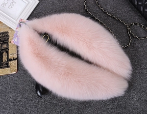 Detail of soft pink faux fur scarf collar showing fluffy texture and premium material