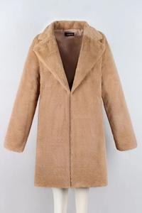 Detailed close-up of the thick camel faux fur texture and wide collar on long coat