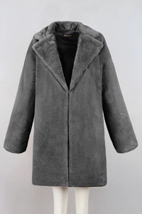 Detail of grey faux fur coat showing soft texture, lapel design and black lining