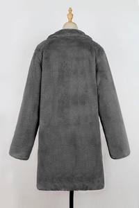 Rear view of a mid-length faux fur coat in dark grey with soft texture on a mannequin
