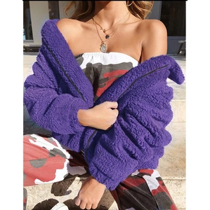 Detailed texture of purple faux shearling fleece jacket with full zipper and stand collar