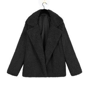Detail of fashion black faux fur coat with lapel collar and soft satin lining