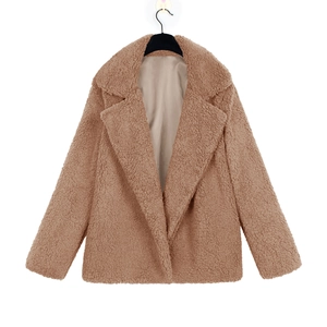 Detailed view of neutral faux shearling jacket with notched lapel and smooth lining