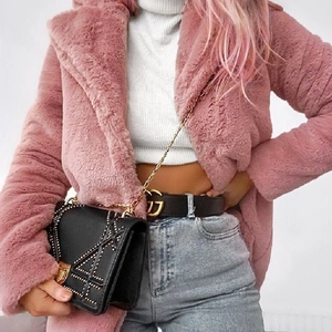 Chic pink faux fur coat with oversized lapels and fluffy texture in casual loose fit