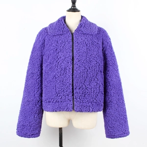 Detail of purple faux shearling jacket featuring wide lapels and metal zipper closure